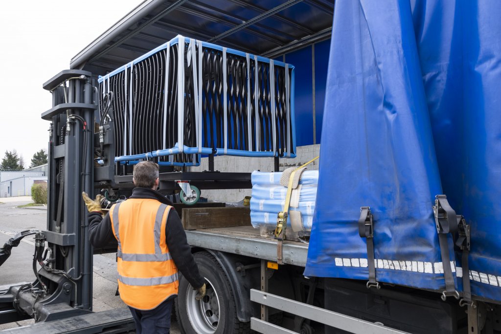 Banksman directing loading of balcony onto lorry