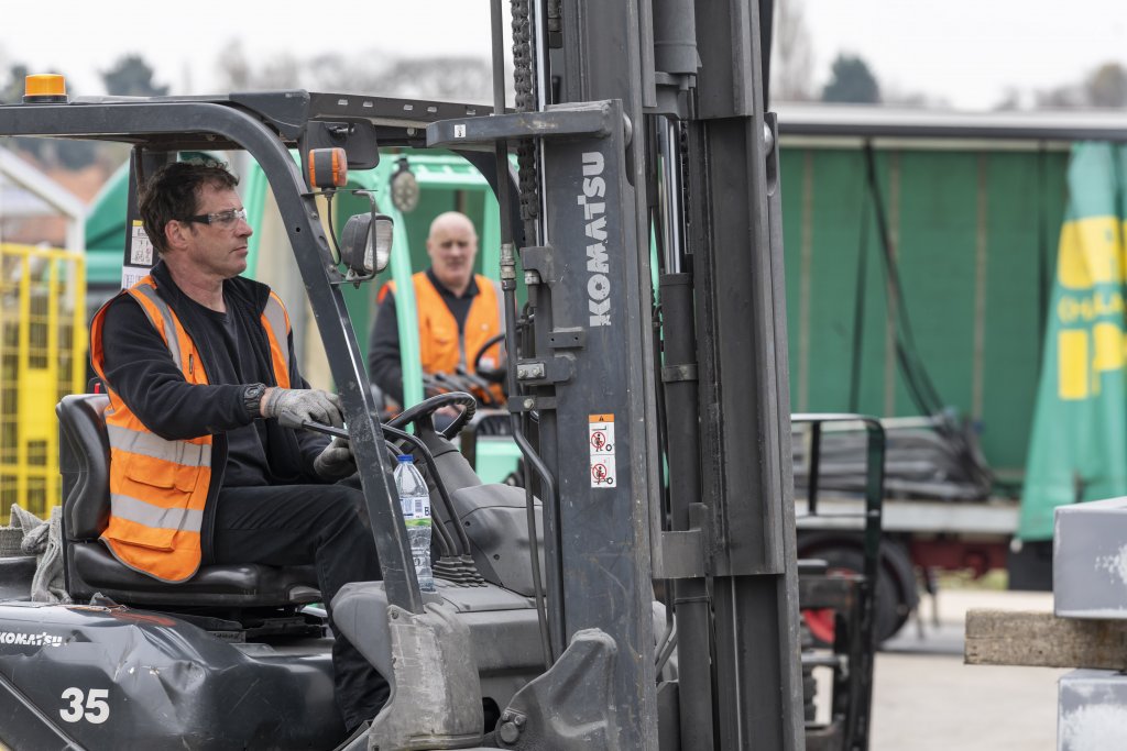 Fork-lifts in action - x2 Two fork-lift operatives in action